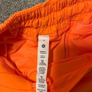 New neon orange lululemon shorts in size four never worn